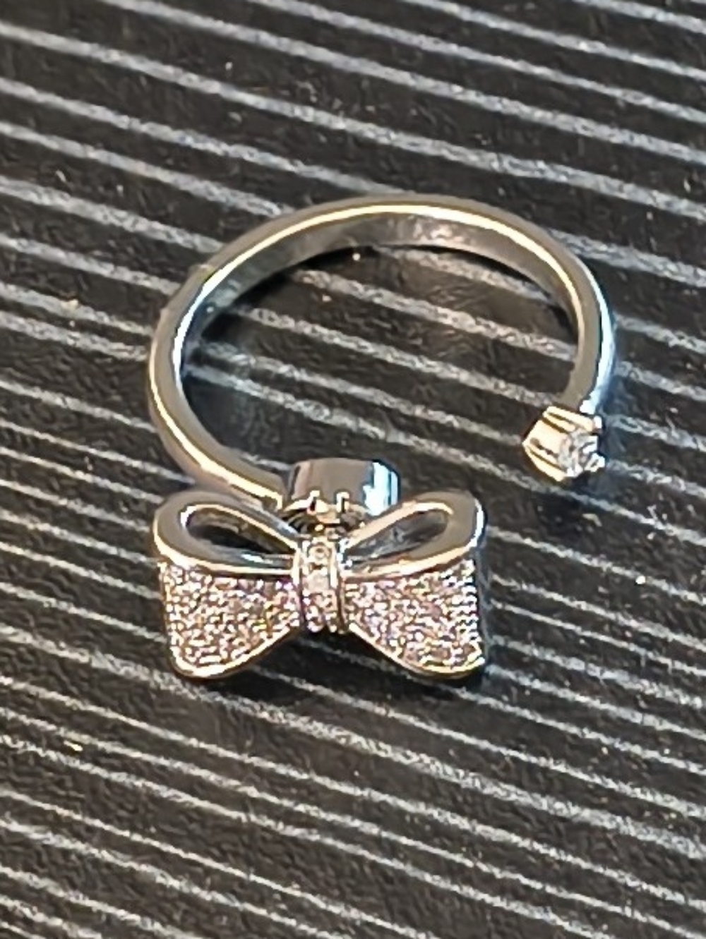 Silver Tone Bow Spinner Ring Adjustable Fidget Ring Cubic Zirconia Accent